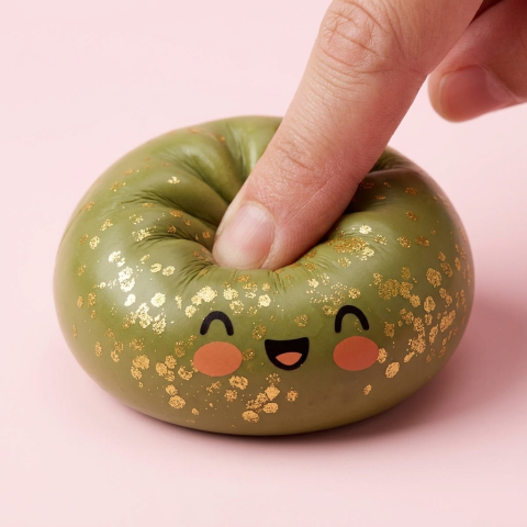 Dumpling Squishy Vert Émeraude Glitter pressé dans la main, matière squishy