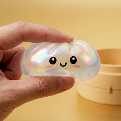 Squishy Dumpling Holographique Iridescent — effet slow-rise, la mousse regonfle