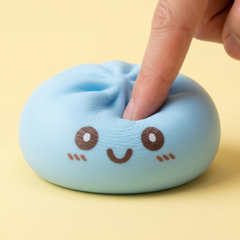 Squishy Dumpling Bleu Géant Jumbo pressé dans la main, matière squishy