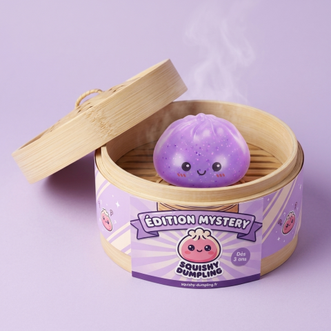 Dumpling Squishy Mystery Glow In Dark Glitter dans sa boîte panier vapeur bambou