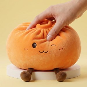Giant Dumpling Squishy Orange pressé dans la main, matière squishy