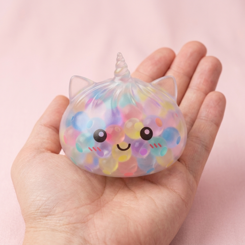 Squishy Dumpling Licorne Pastel Multicolore Bubble tenu en main, taille réelle