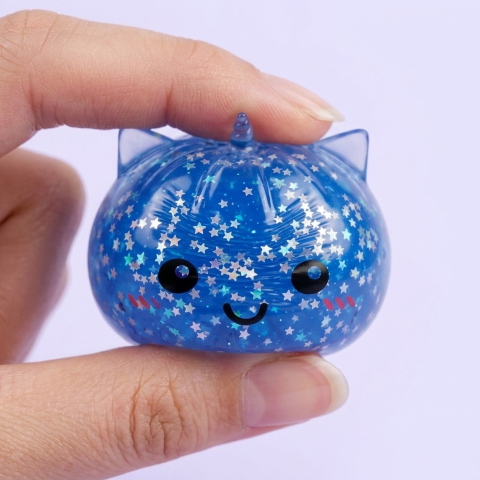 Squishy Dumpling Licorne Mystery Glitter pressé dans la main, matière squishy