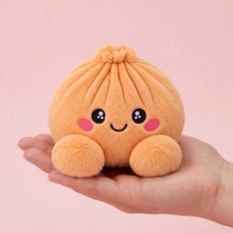 Squishy Dumpling Orange Mandarine tenu en main, taille réelle